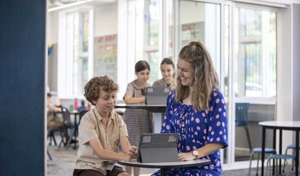 STWW students using an iPad with teacher