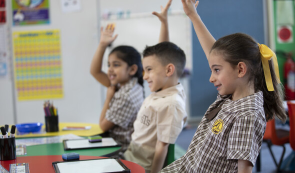 STWW students with hands raised v2